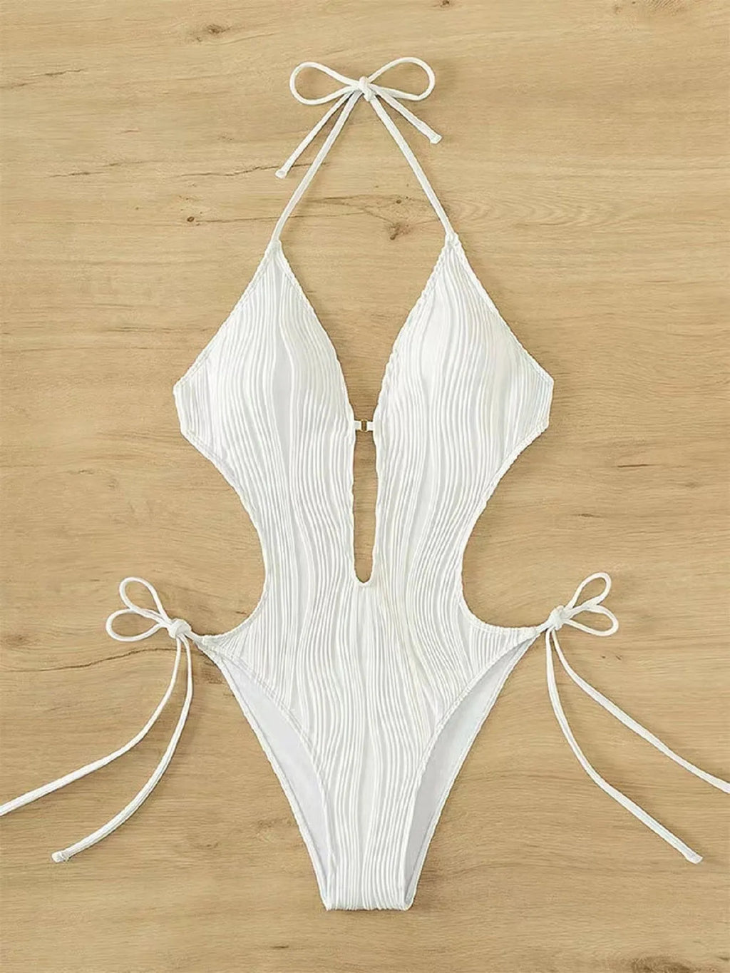Women's black lace-up triangle bikini swimsuit on mannequin showing adjustable top details
