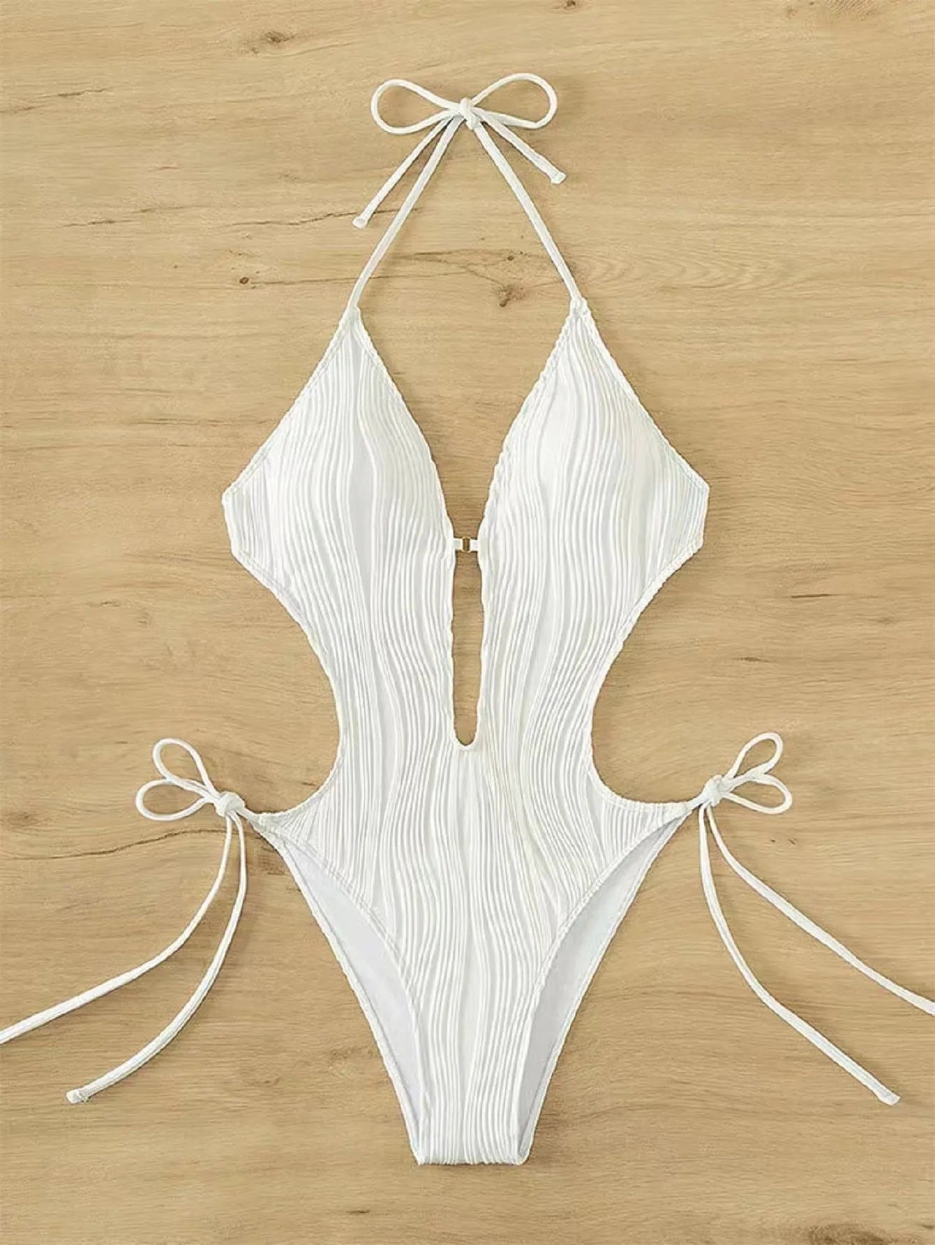 Women's black lace-up triangle bikini swimsuit on mannequin showing adjustable top details
