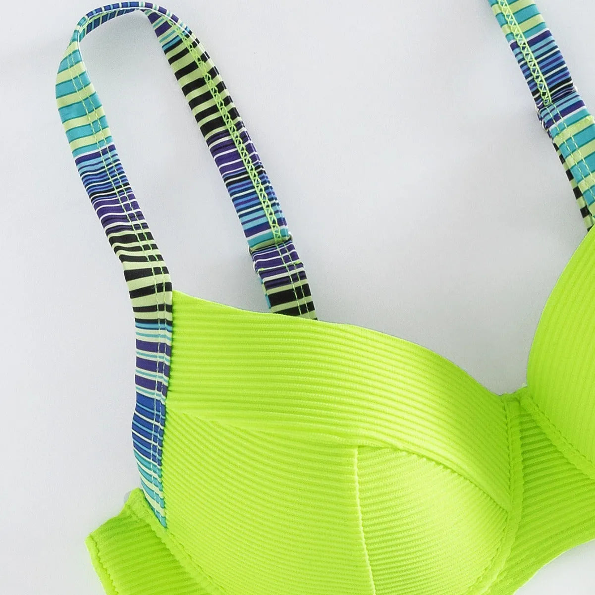 Green printed halter neck bikini set with split briefs on white background