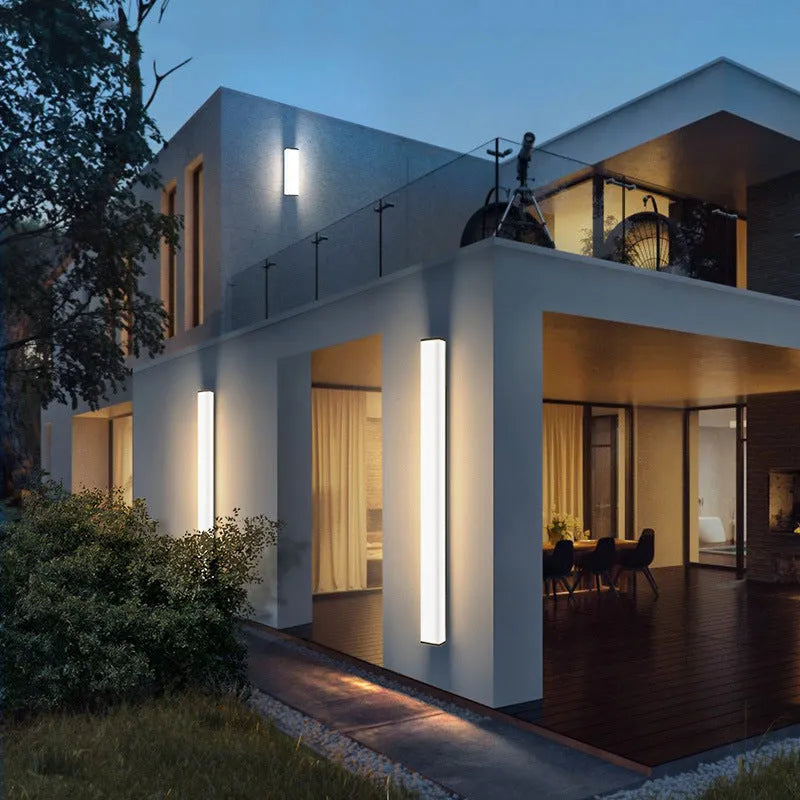 Vertical stainless steel outdoor wall light with polycarbonate diffuser, 60cm height.