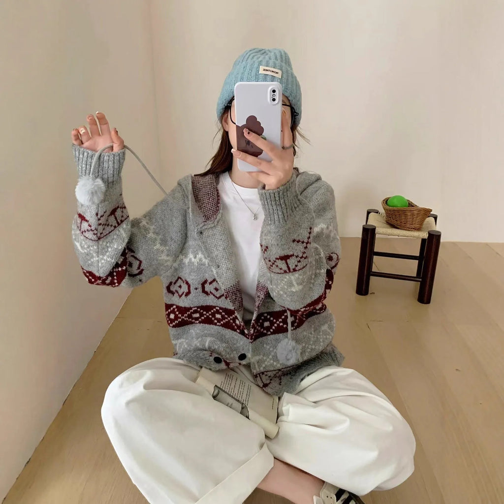 Plus size women's grey brocade sweater coat with geometric pattern and long sleeves.