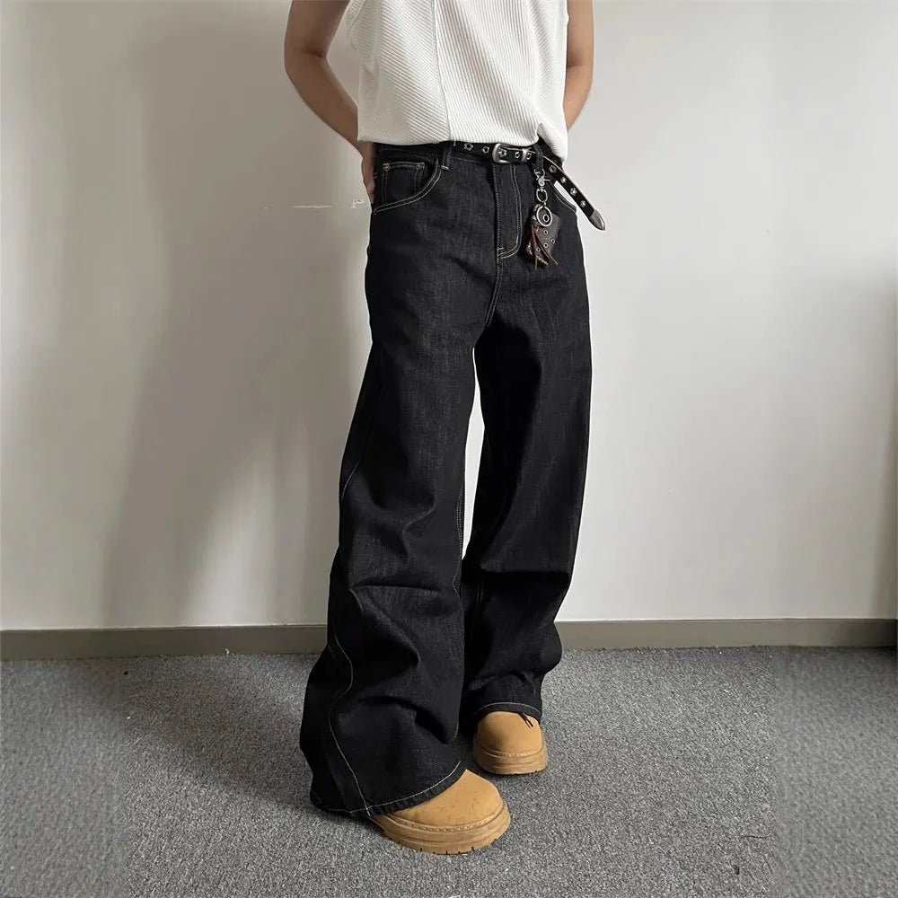Man and woman modelling black retro wide-leg denim jeans with a straight loose fit.