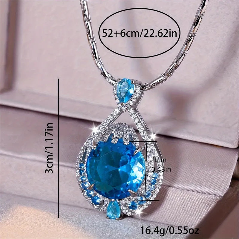 Blue geometric crystal necklace with fireworks-cut pendant on water wave chain