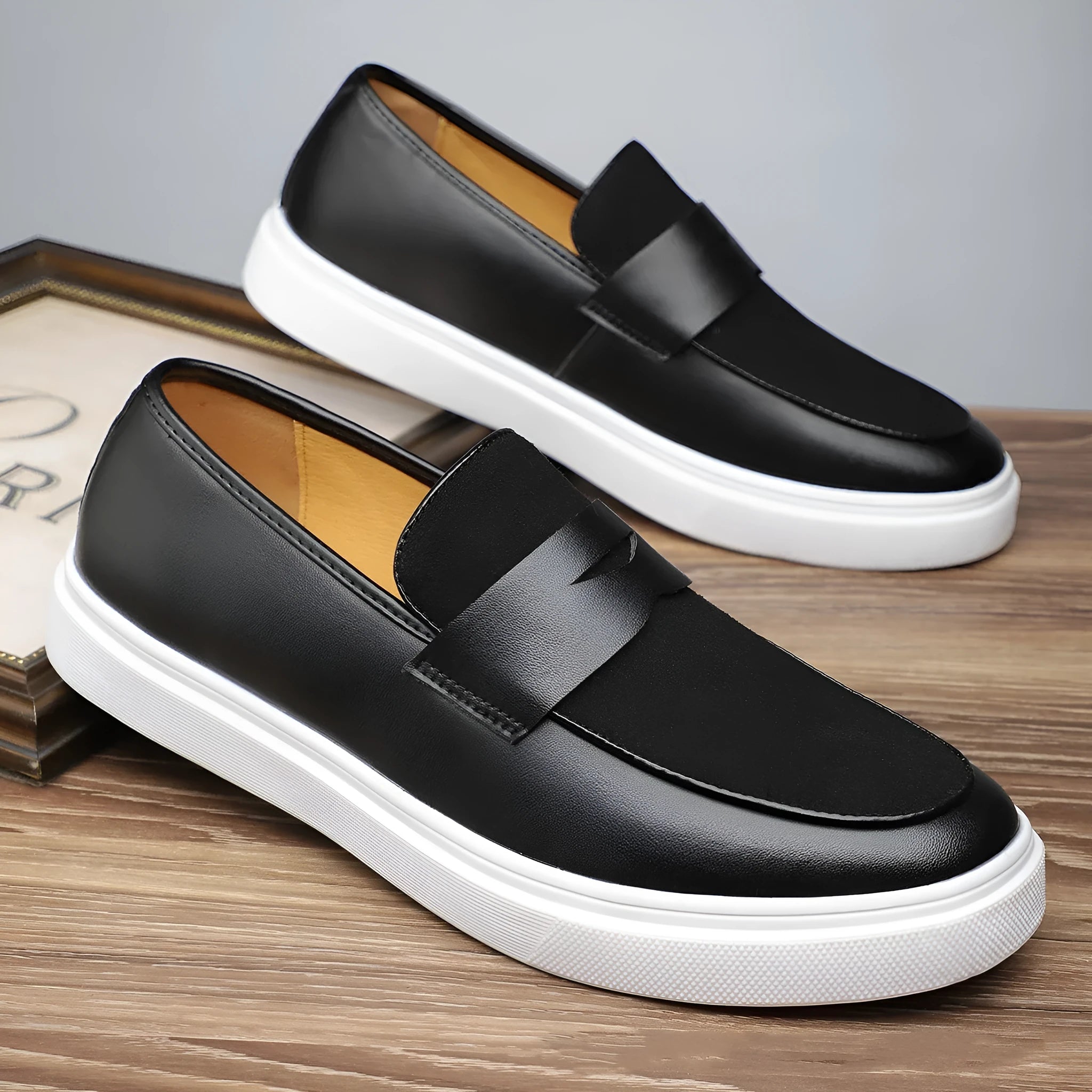 Men's slip-on gommino British style casual shoes in black with tassel detail, mid heel, and round toe