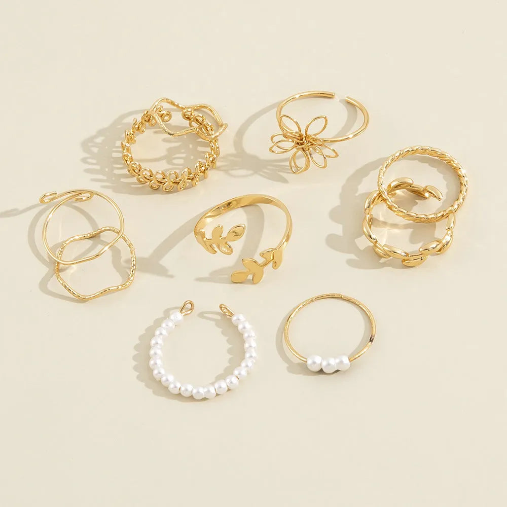 Gold tone openwork flower design alloy ring for women with glossy electroplated finish