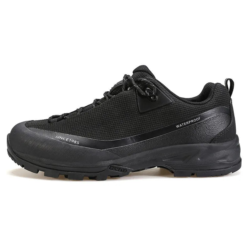 Men's low-top leather mesh hiking boot in black with lace-up front and rubber outsole.