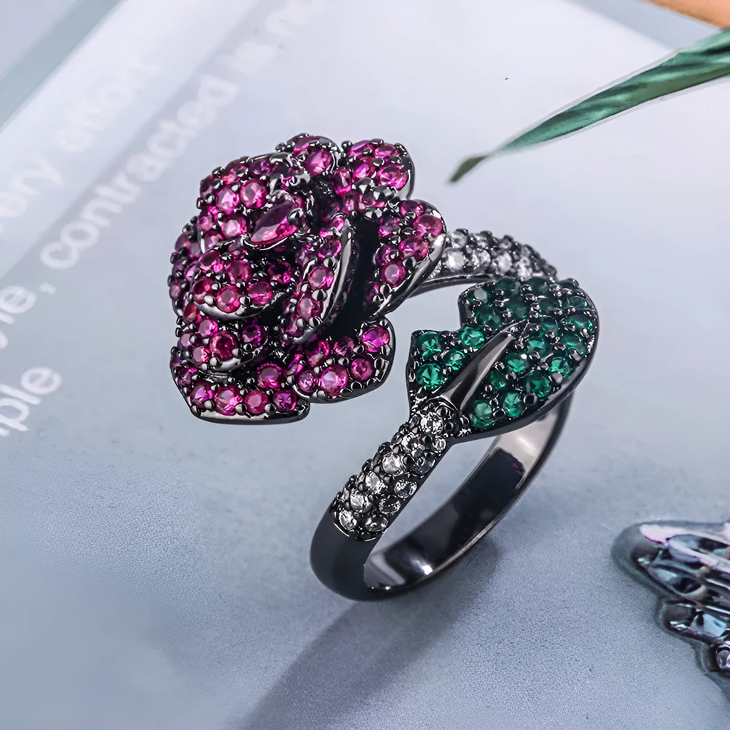 Women's geometric flower ring in black gold with simulated red corundum stone on gold-plated copper band