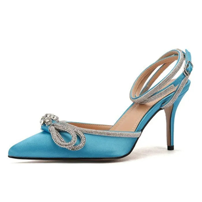 Women's black stiletto heel sandals with a silk bandage across the back and a buckle strap.
