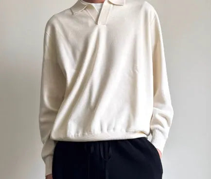 Men's pure wool polo sweater with lapel collar in milky white colour showing loose fit and long sleeves