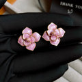 Gold plated copper flower stud earrings with oil-spot glaze in golden-purple colour