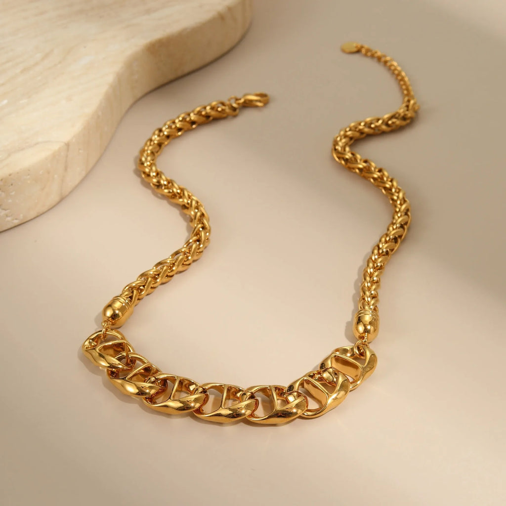 Women's stainless steel necklace with geometric pendant and gold plating on regular chain