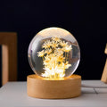 3D dandelion crystal ball LED night light on a beech wood stand, showing USB cable.