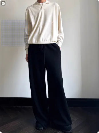 Men's pure wool polo sweater with lapel collar in milky white colour showing loose fit and long sleeves