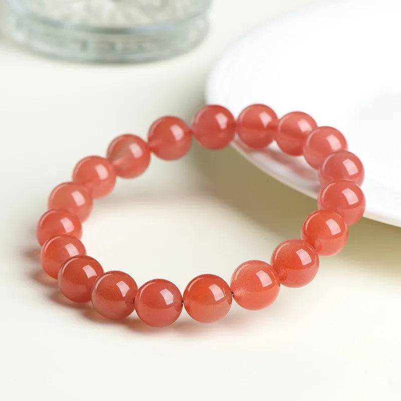 Natural South Red Cherry Agate bracelet showing polished beads in a single circle design.