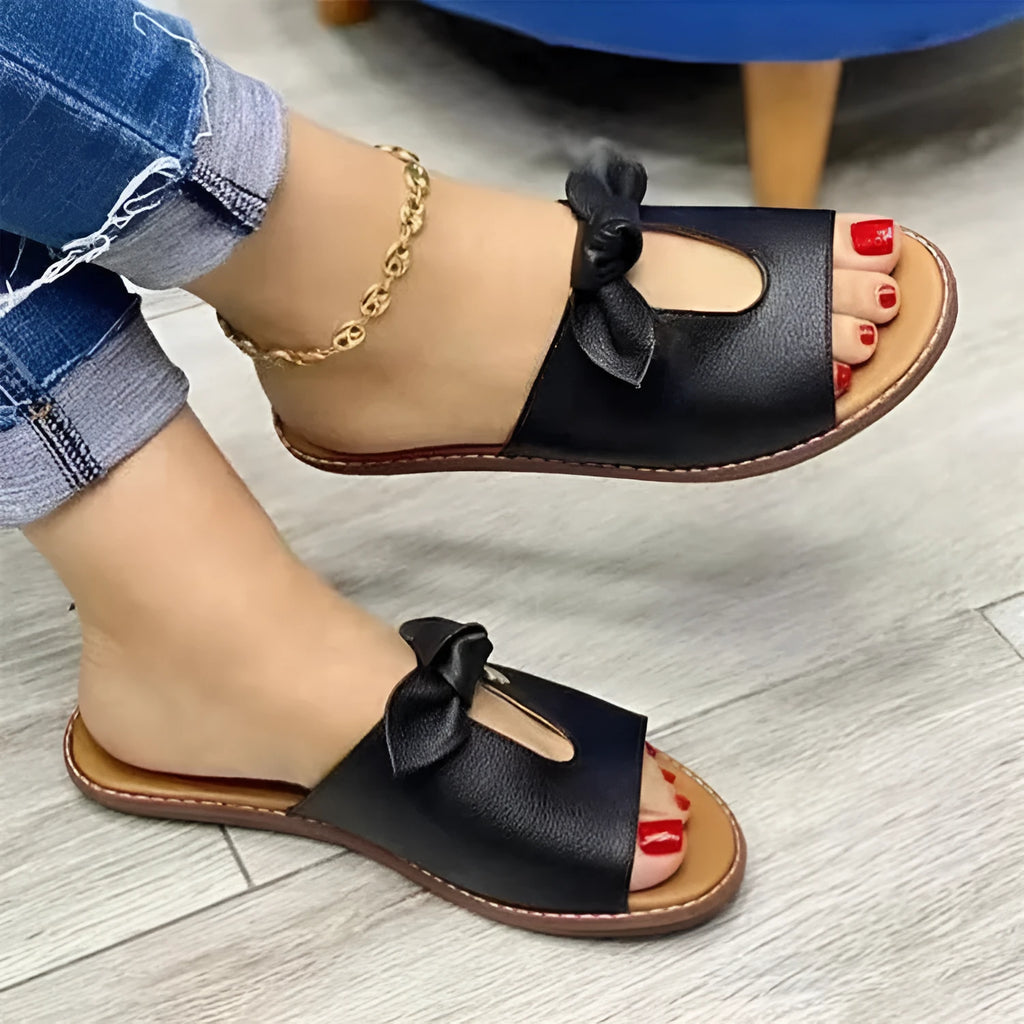 Ladies sandals with bow detailing and fish mouth slipper style in black, gold and pink colours
