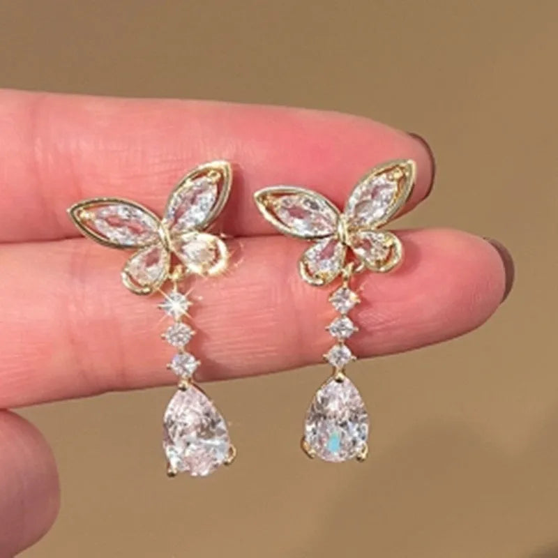 Platinum bow stud earrings with zinc alloy construction and electroplated finish