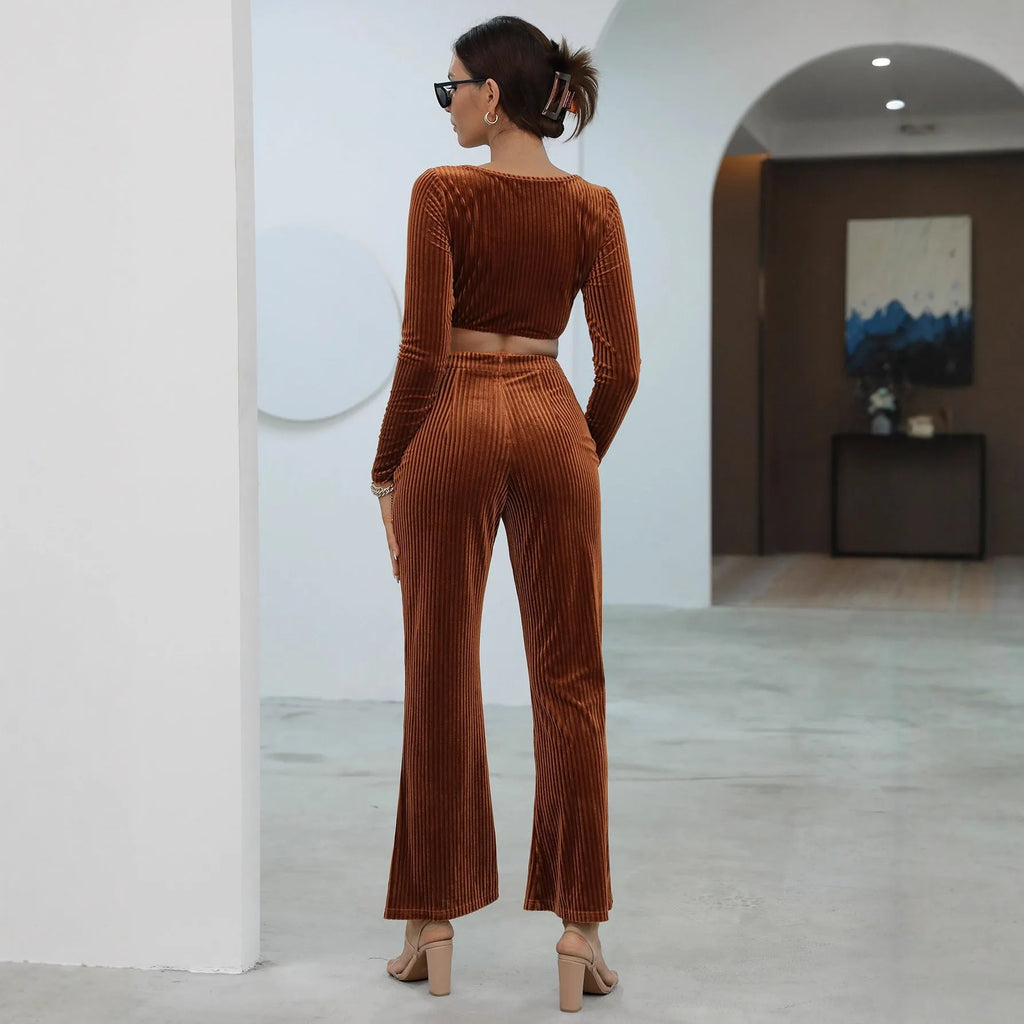 Caramel coloured women's long sleeve sweater and trouser casual set on a hanger.