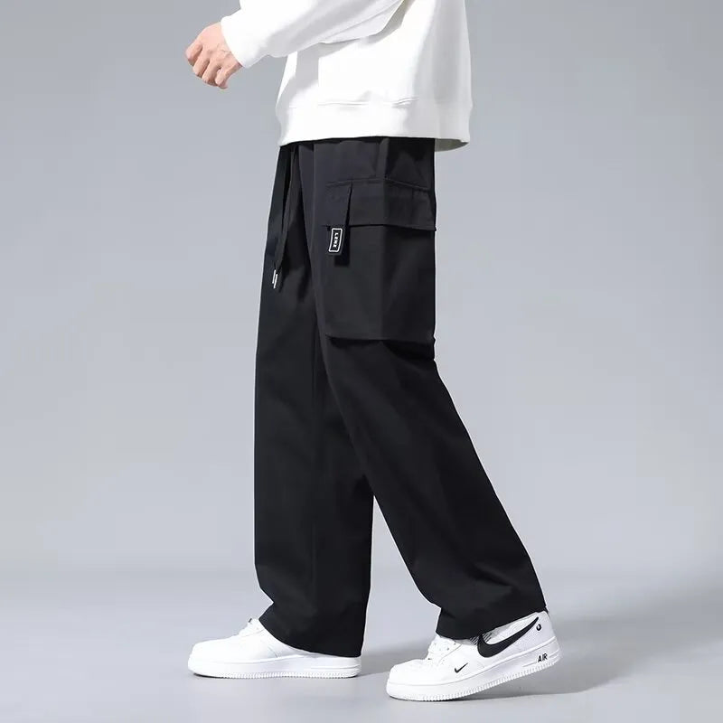 Boys straight leg cargo trousers with drawstring waist and large pockets in polyester fabric
