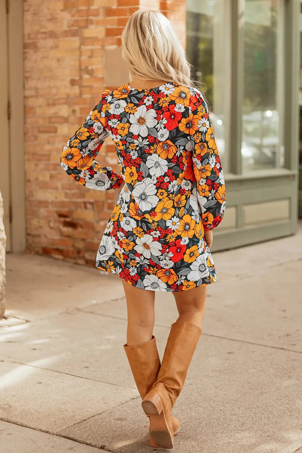 Orange floral print mini dress with V neck, long sleeves and vertical striped lace detailing