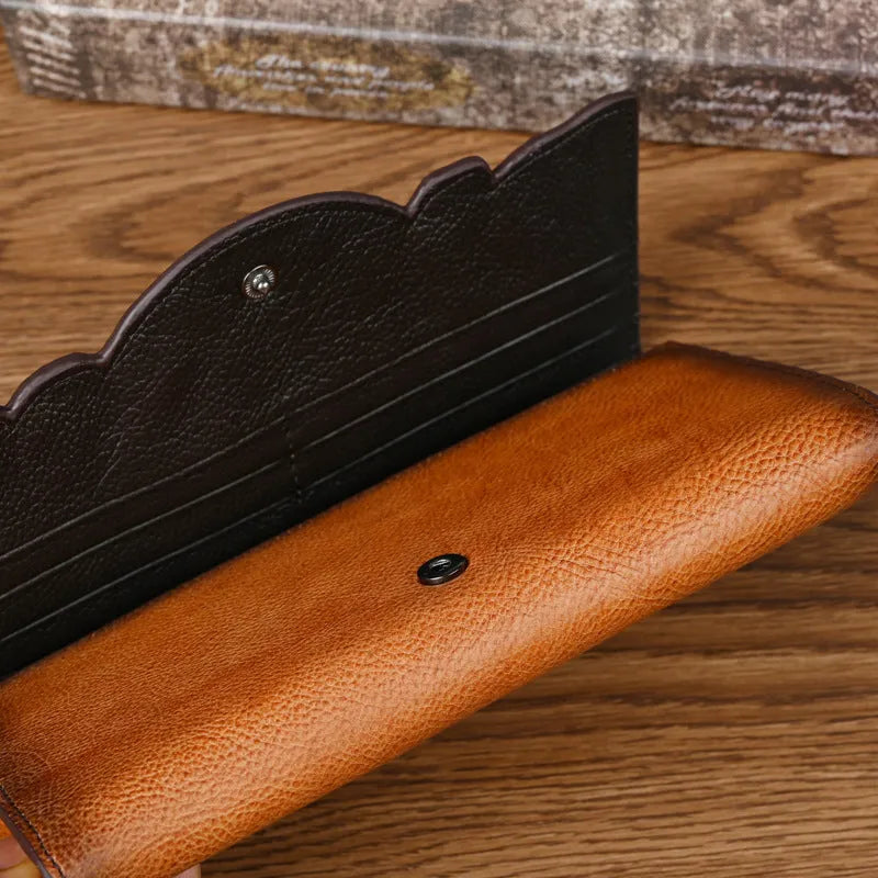 Chinese-style floral embossed tri-fold leather wallet in retro brown showing opened compartments
