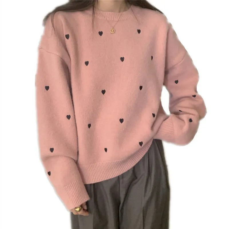 Women's acrylic pullover sweater with embroidery detail in milky white colour showing loose fit design