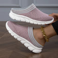 Women's black Flyknit semi-slipper shoe with striped pattern and raised sole