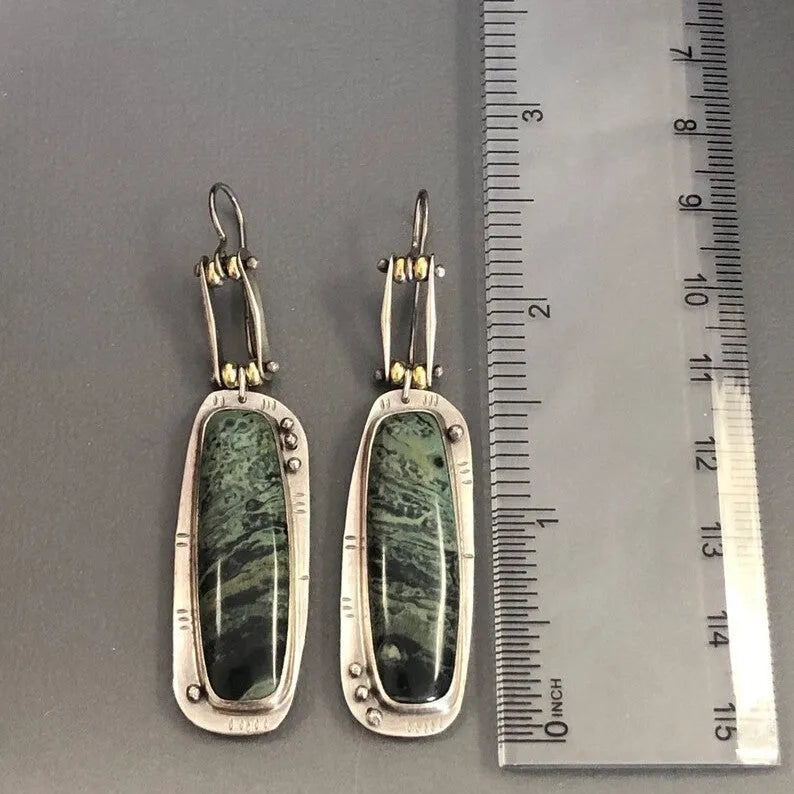 Two-tone marble pattern geometric drop earrings with alloy construction, front and side views