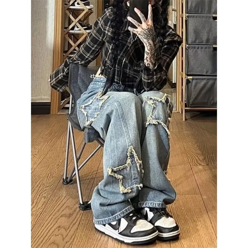 Blue high-waisted wide-leg denim pants with straight-leg silhouette on hanger