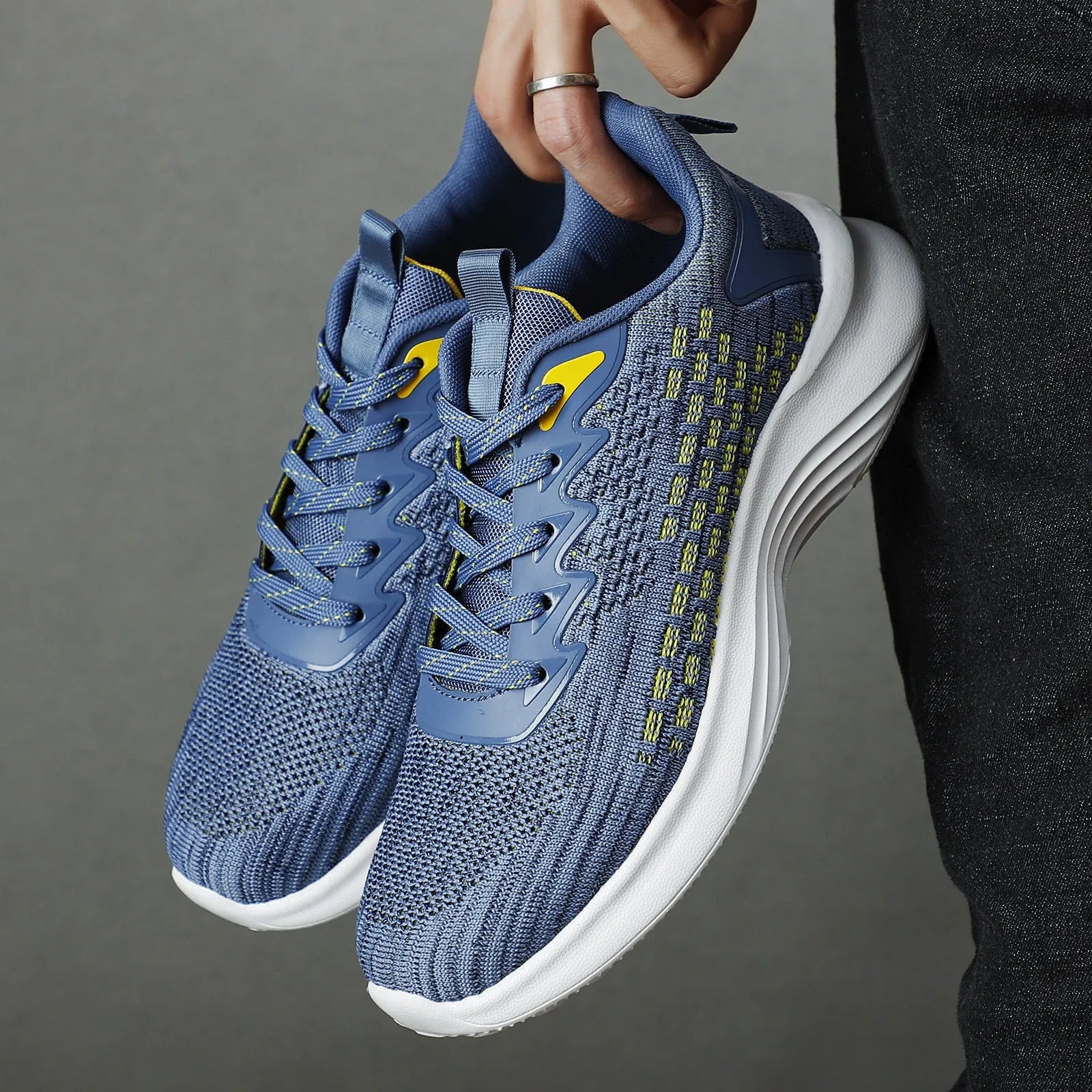 Women's lavender purple Flyknit running shoes with mesh lining and striped pattern on a white background.