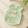 Colourful hollowed-out knitted cat clothing with a cartoon bear patch on the back