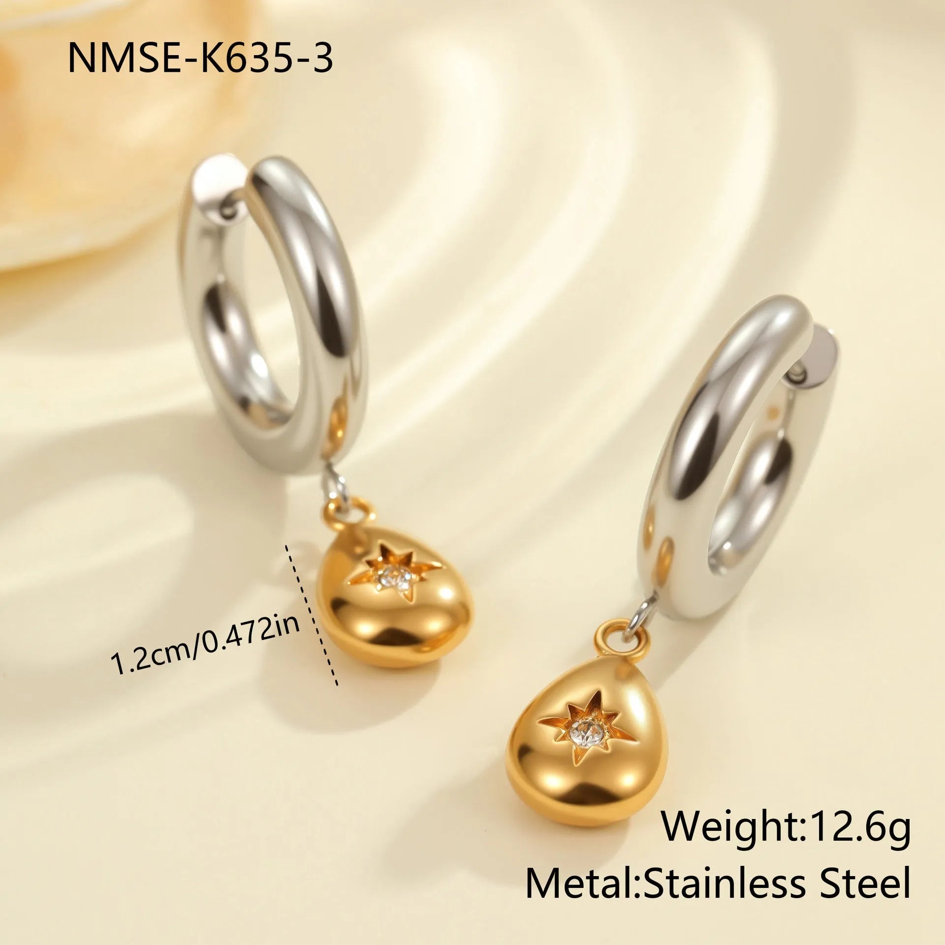 Christmas tree heart earrings in stainless steel with 18K gold plating showing star and geometric shapes