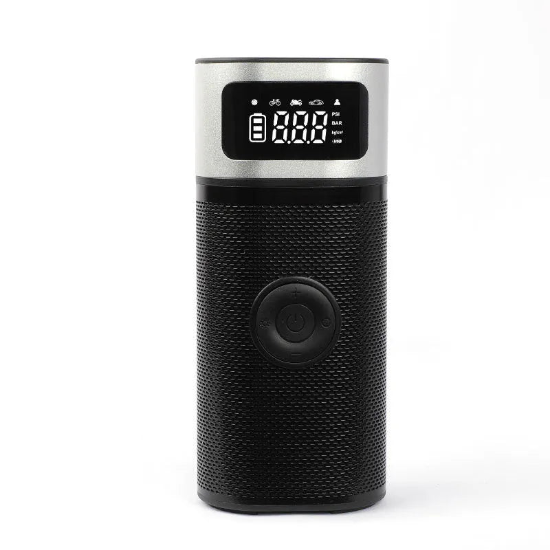 Black portable wireless smart vehicle air pump with hoses and nozzles on a storage bag.