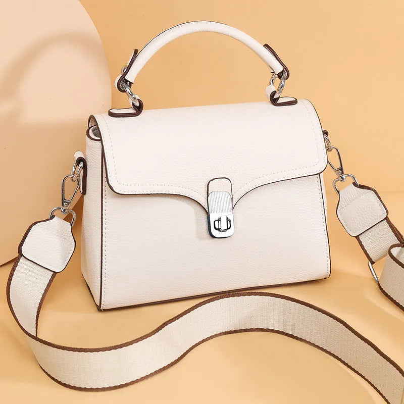 Korean commuter women's cross-body bag in genuine leather, oval shape, size 21x18x9cm, available in black