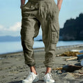 Men's solid colour linen casual trousers with ankle ties and a drawstring waist.