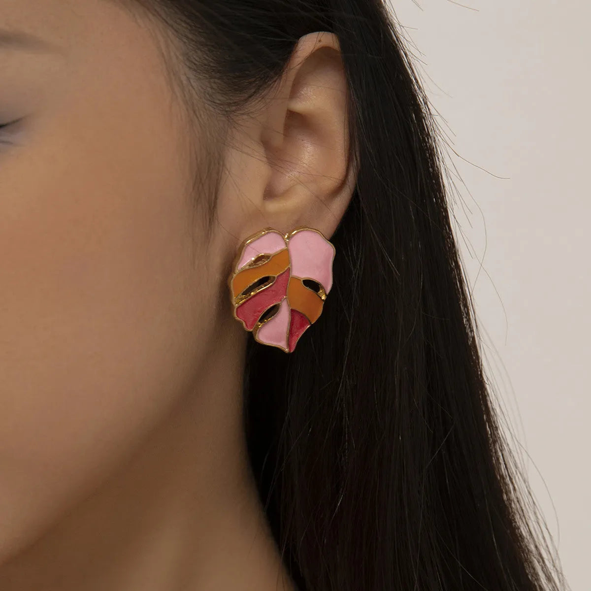 Maple leaf stud earrings with handmade drop oil finish, electroplated alloy, available in green or pink.
