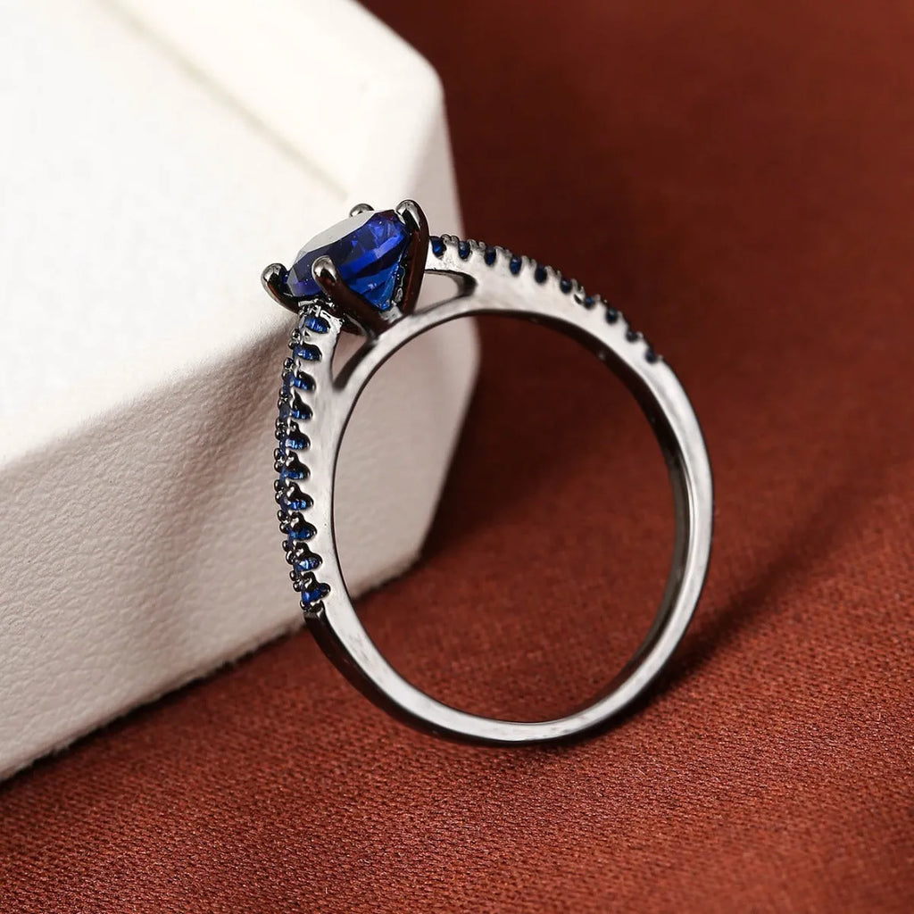 Geometric hexagon copper ring with colourful zircon stones in a silver white finish.