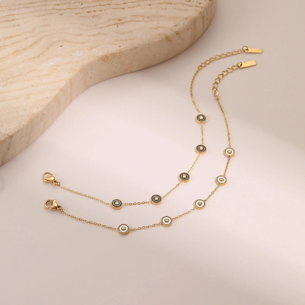 Women's stainless steel bracelet with 18K gold plating and geometric fritillary pattern design