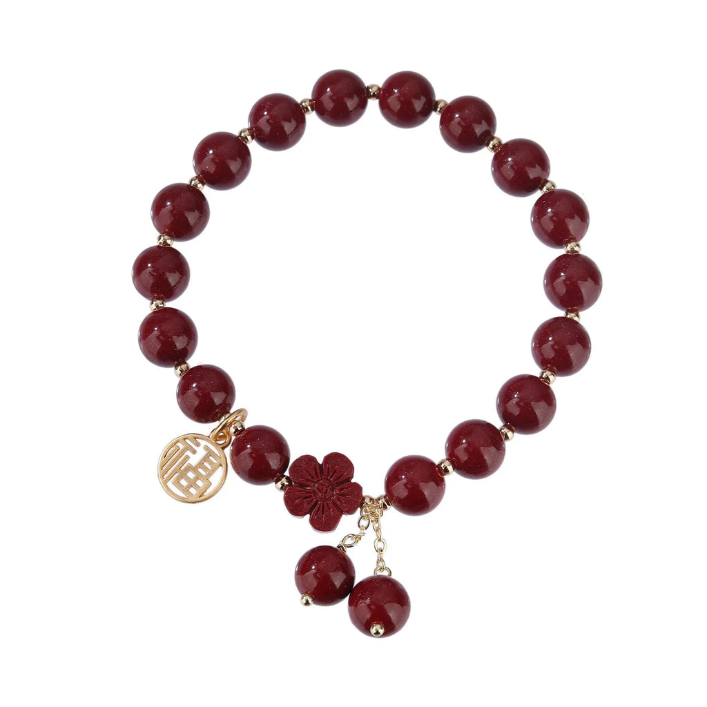 Retro women's cinnabar bracelet with Fu character charm in purple gold sand colour