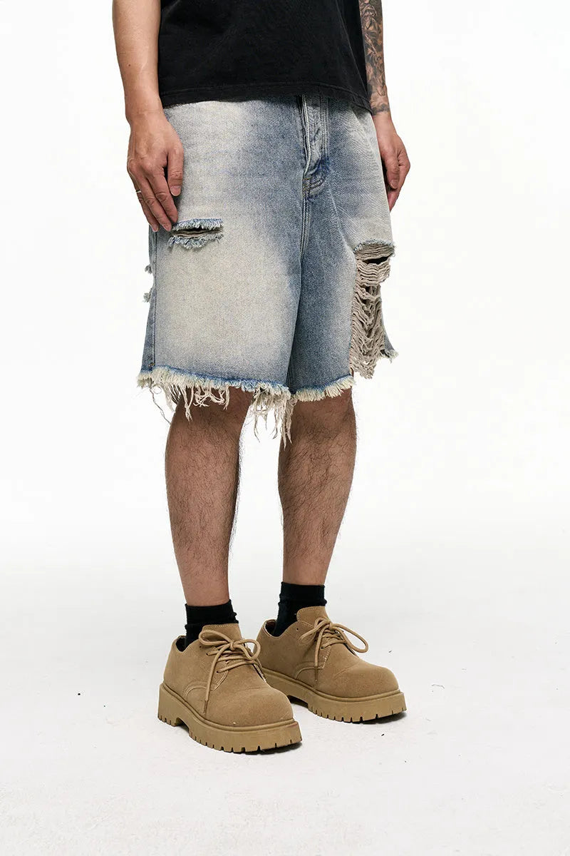 Light blue baggy denim shorts with wide leg cut and zipper fly