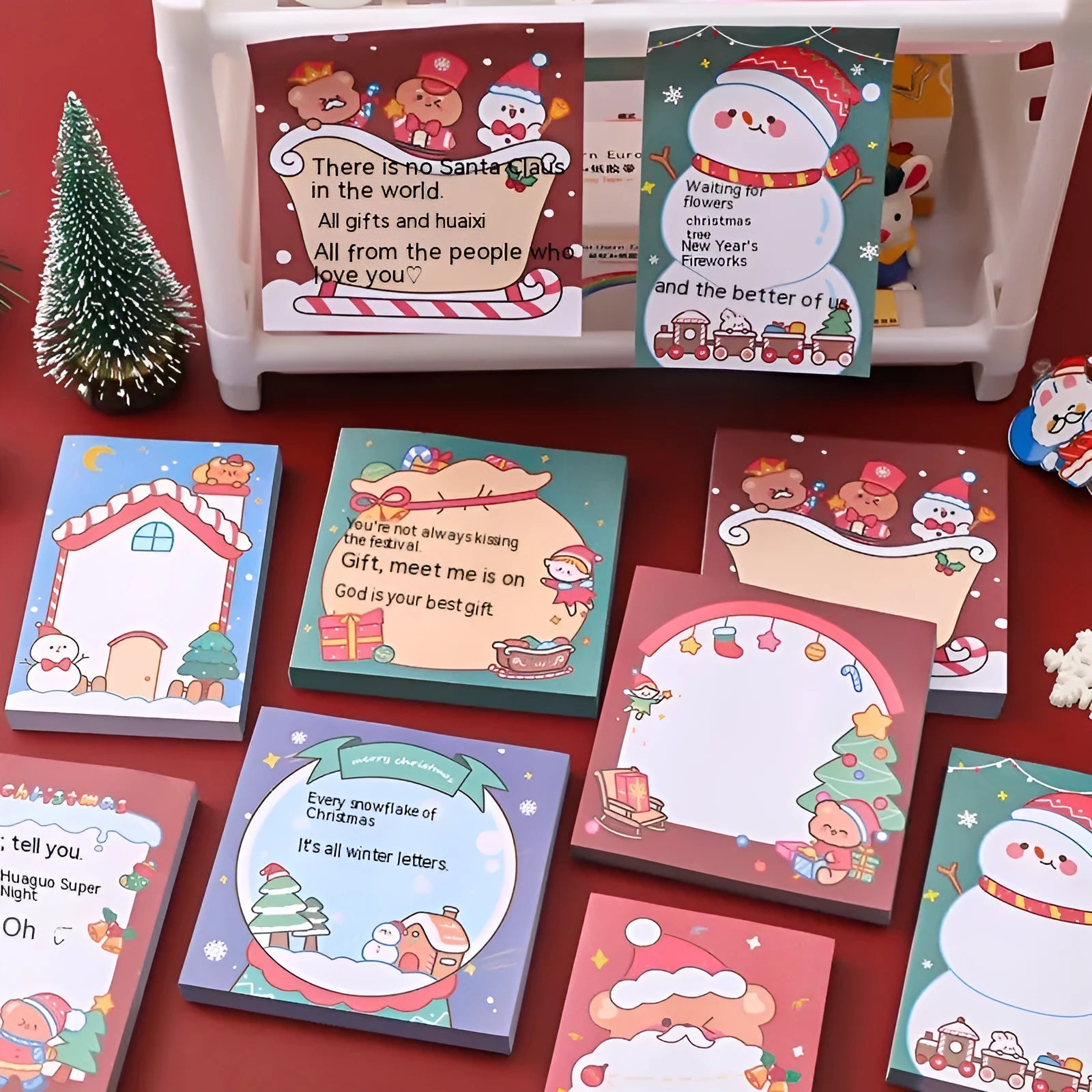 Christmas cartoon sticky notes pad showing eight festive designs including Santa Claus, snowman, and Christmas elf