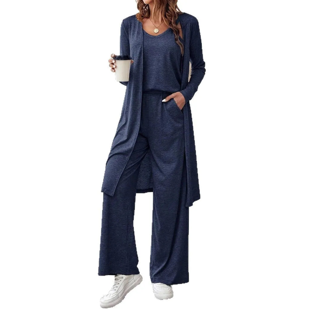 Blue women's three-piece co-ord set with sling top, long cardigan, and trousers on a hanger.