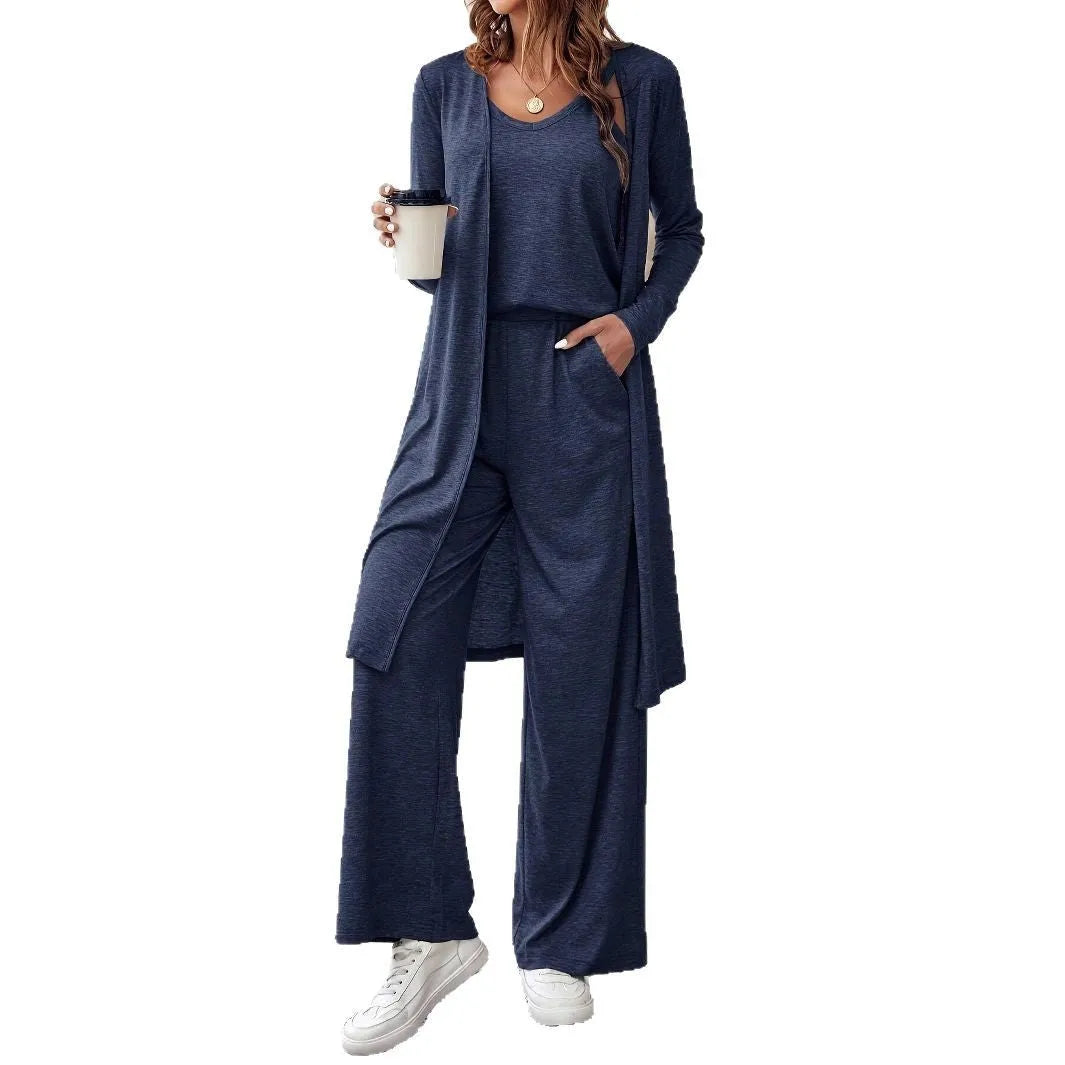 Blue women's three-piece co-ord set with sling top, long cardigan, and trousers on a hanger.