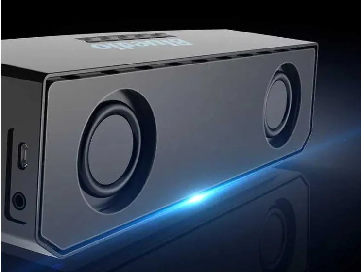 Black Bs-6 Bluetooth smart speaker on a desk showing its compact rectangular form.