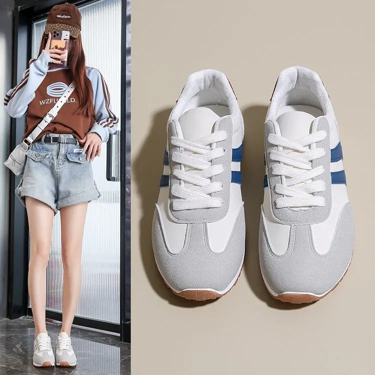 Blue and grey leisure sports shoes with Cortez stripes pattern, flat rubber sole, and round toe design
