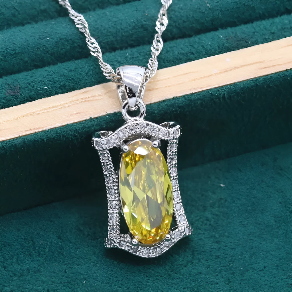 Yellow and olive anti-allergy zircon jewellery set with necklace, earrings, ring, and bracelet on a snake bone chain.