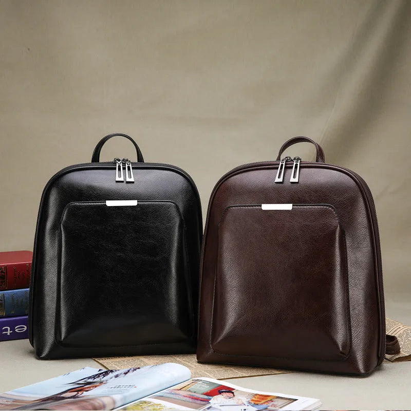 Women's fashion PU backpack in Black with shoulder strap and fabric lining, front view