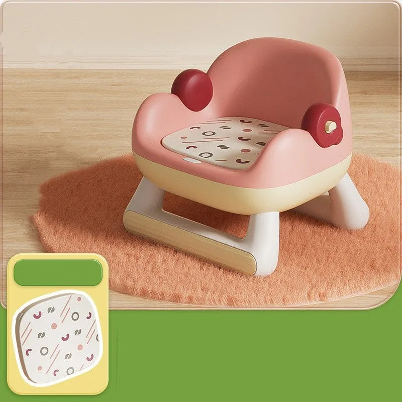 Blue plastic children's dining chair with backrest and PVC soft cushion on a white background