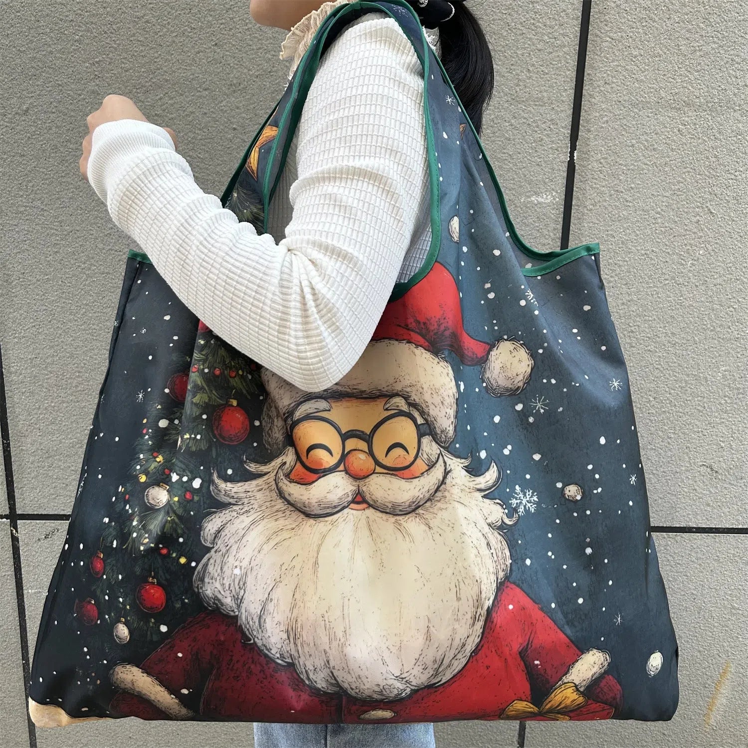 One-shoulder Santa Claus gift bag in red with festive design, large polyester bag with Santa pattern