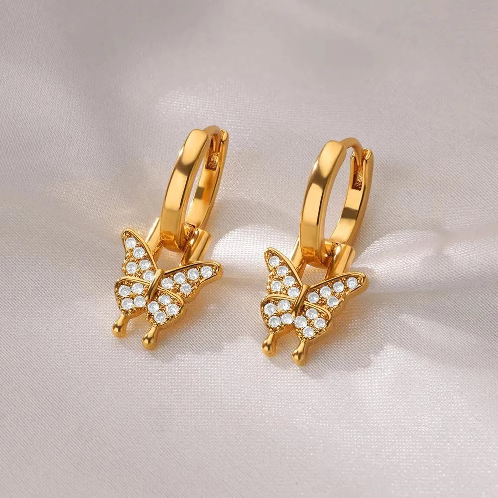 Women's irregular geometric butterfly earrings in copper with heart, bow and star motifs