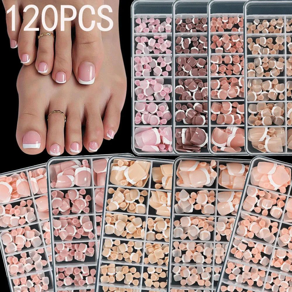 Box of 120 short square false toenails with French white tip design on nude base.